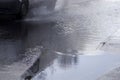 Car rides on big puddle. Water splash. Manchester England. Royalty Free Stock Photo