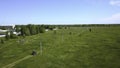 Car rides on country field road on sunny summer day. Clip. Car is moving along field road in green field in summer Royalty Free Stock Photo