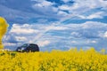 Car rides. field with a rainbow in the sky Royalty Free Stock Photo