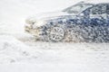 Car rides through a snowstorm