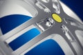 Car rim close-up view with depth of field effect on blue background. 3d illustration
