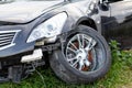 Car in road accident. Close-up of wheel and headlights Royalty Free Stock Photo
