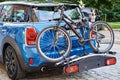 Car with road bicycle loaded on rack Royalty Free Stock Photo