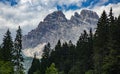 Car on a road in Dolomite Mountains with Forested Slopes in Italy Royalty Free Stock Photo