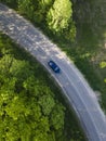 Car on road in the forest in summer time nature from air . View from a drone. Aerial view Royalty Free Stock Photo