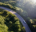 Car on road in the forest in summer time nature from air . View from a drone. Aerial view Royalty Free Stock Photo