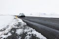 Car on Road Leading Through Frozen Winter Landscape in Iceland Royalty Free Stock Photo