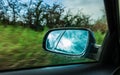 Car on the road and rear view mirror Royalty Free Stock Photo