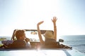 Car, road trip and travel with a couple by the beach on a drive to enjoy the view during summer together. Freedom Royalty Free Stock Photo