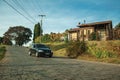 Car on a road and wood house with garden Royalty Free Stock Photo