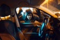 Car robber with flashlight looking for goods Royalty Free Stock Photo