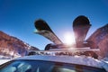 Car roof with two pairs of skis on the rack