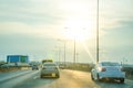 Car running on the freeway with a sunrise background Royalty Free Stock Photo