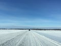 Car running on ice road in remote arctic region Russian tundra landscape in