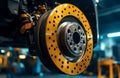 A car's disc brake is being fixed as part of the process of installing new tires Royalty Free Stock Photo