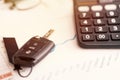 Car sales chart concept visual. car keys, graphics and calculator Royalty Free Stock Photo