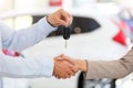 Car salesman handing car keys to woman Royalty Free Stock Photo