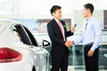 Car Salesman selling auto to customer Royalty Free Stock Photo