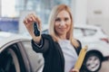 Saleswoman working at car dealership Royalty Free Stock Photo