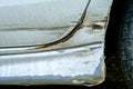 Car scratches dents and holes. Silver color vehicle needs repair