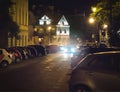 Car searching free parking space at night in city or town center. Vehicle trying to find place to park and stop.