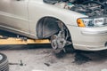 Car service center concept, vehicle raised on lift at maintenance station, auomobile repair and check up, repairing car Royalty Free Stock Photo