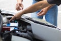 car service center mechanics are checking condition car and engine make sure they are ready use and in perfect condition according Royalty Free Stock Photo