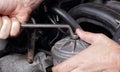 Car service - Engine repair hand with wrench fuel filter