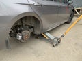 Car in a car service, repair of wheels. Concept: tire fitting, vulcanization, tire change. Car on a jack, changing wheels. Kiev