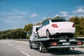 Car Service Transportation Concept. Tow Truck Transporting Car Or Help On Road Transports Wrecker Broken Car. Auto