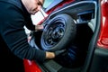 Car service worker disassemble the interior of the car