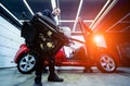 Car service worker disassemble the interior of the car