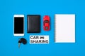 Car sharing concept. Composition with driver`s license, blank paper, toy car, car key and text sign `CAR SHARING` Royalty Free Stock Photo