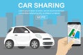 Car sharing concept,white car and hand holding smartphone with c Royalty Free Stock Photo