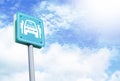 Car sharing parking sign over blue sky and clouds. Royalty Free Stock Photo