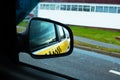 Car side mirror with taxi sign reflection Royalty Free Stock Photo