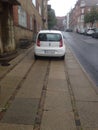 Car on sidewalk Royalty Free Stock Photo