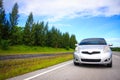 Car silver Running on a tree road along the way. Royalty Free Stock Photo