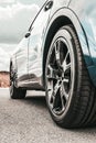 Car on sky background. Car wheels close up on a background of asphalt. Car tires. Car wheel close-up. for advertising Royalty Free Stock Photo