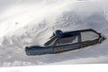 Car in a snowdrift to the very roof, top view. The passenger car was covered with snow. There is a lot of snow outside