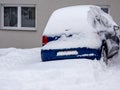 Car is snowed in in the winter chaos