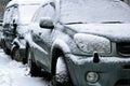 Car during a snowfall in town Royalty Free Stock Photo