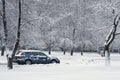 Car during a snowfall in town Royalty Free Stock Photo