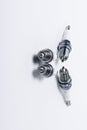 Car spark plugs on white background. Car spare parts