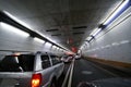 Car speeding and turning tunnel Royalty Free Stock Photo