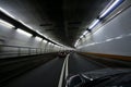 Car speeding and turning tunnel Royalty Free Stock Photo