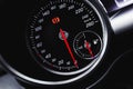 Car speedometer, luxury dashboard with glowing red indicators close-up view, background photo