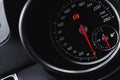 Car speedometer, luxury dashboard with glowing red indicators close-up view, background photo