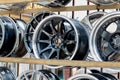 Car sport rims and tyres shown at a tyre shop.