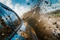 A car sprays mud, ride on the off-road car. Rear side of a car covered in mud Royalty Free Stock Photo